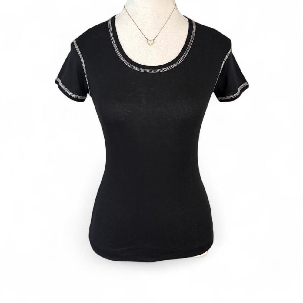 Black cotton baby tee with white stitching along neckline and sleeves Size M